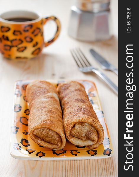 Pancakes With Meat Filling On The Wooden Table