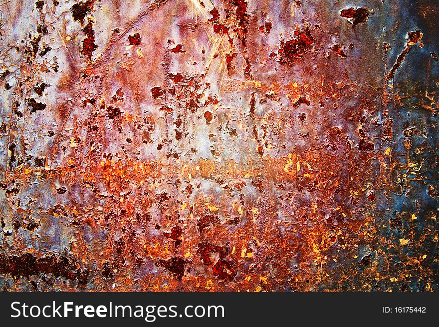 Oxidized  metal sheet covered with old paint.