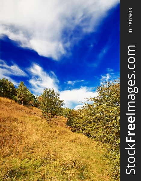 Nice autumnal hill and wonderful blue sky with clouds. Nice autumnal hill and wonderful blue sky with clouds.