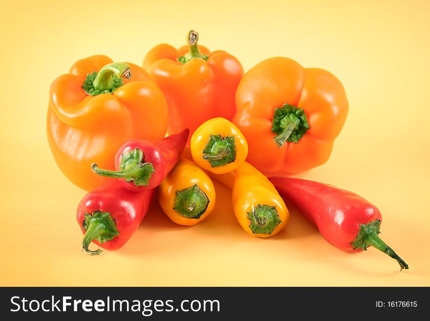Hot chili peppers and big sweet peppers. Hot chili peppers and big sweet peppers