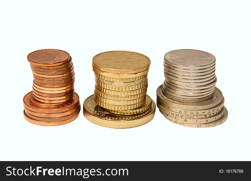 Piles of coins isolated on white background