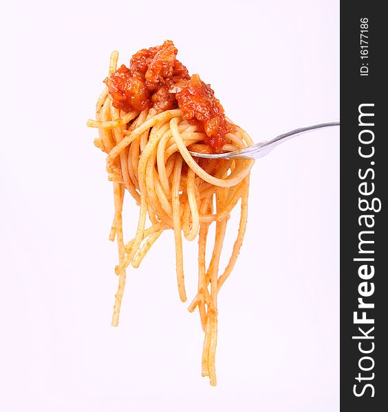 Spaghetti with bolognese sauce hanging on a fork. Spaghetti with bolognese sauce hanging on a fork