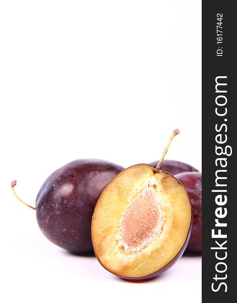 Plums on white background - with space for text. Plums on white background - with space for text