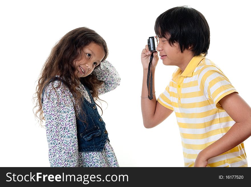 Children take photos digital, portrait with photo camera against white background