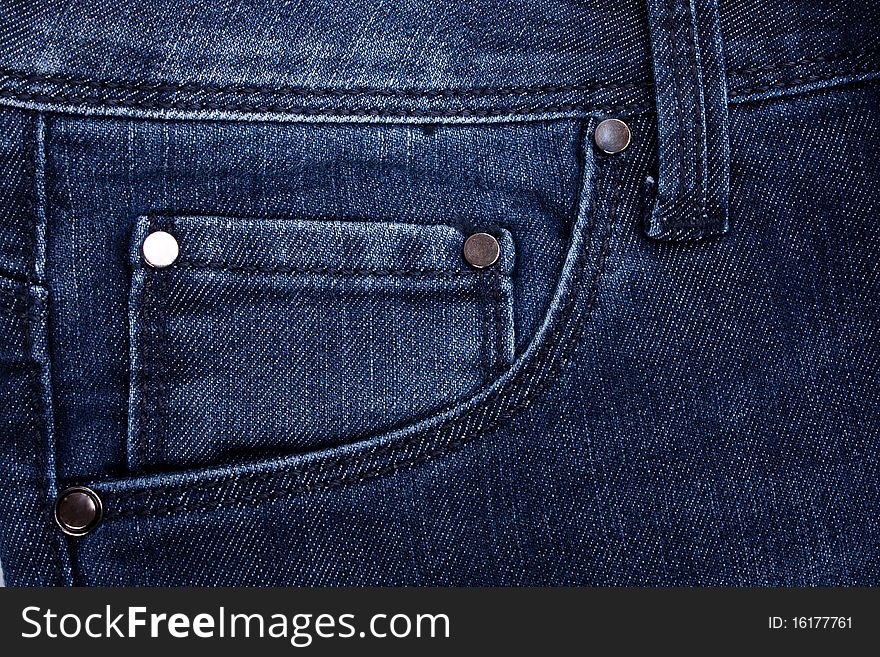 Forward pocket of jeans with the leather tablet