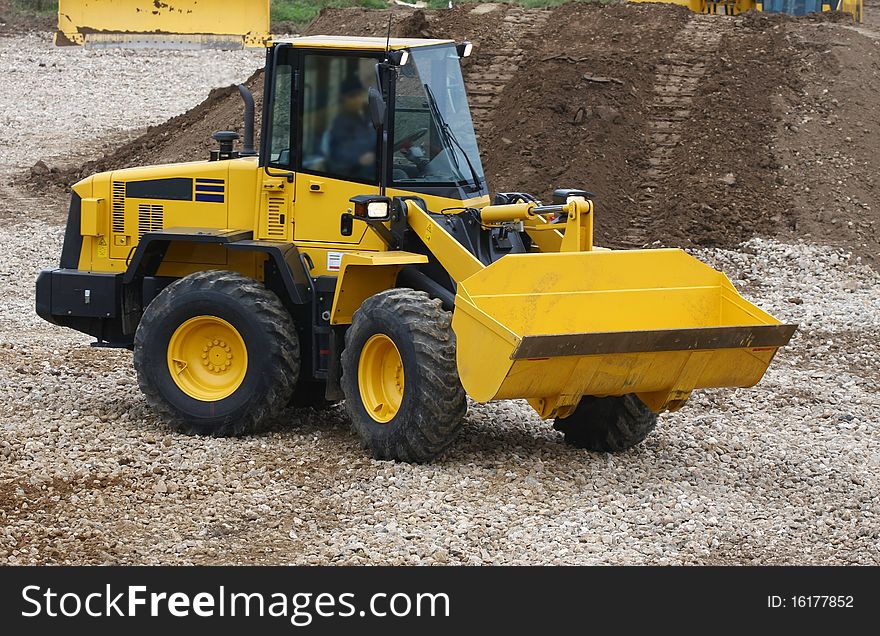 The image of bulldozer under the white background