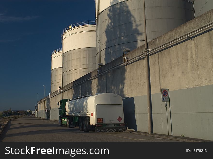Tanker Truck parked in front of Fuel storage tanks