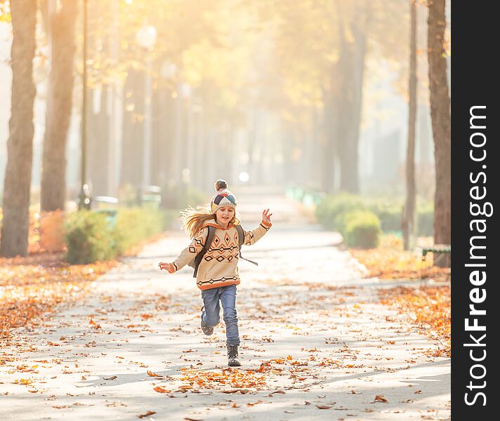 Pretty Schoolgirl Running In Park