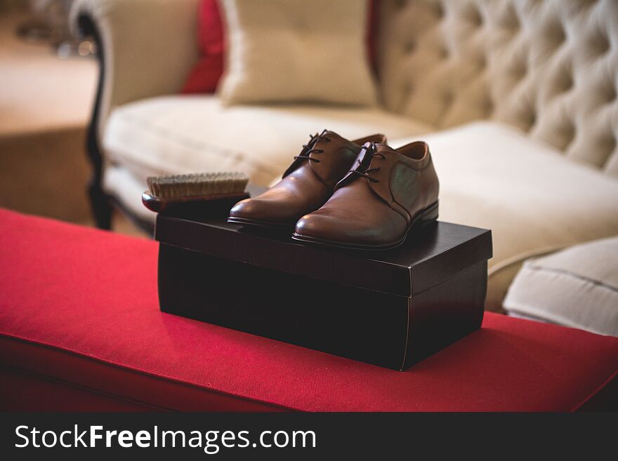 Casual brown leather male shoes on the box