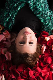 Woman On Rose Petals Royalty Free Stock Image