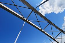 Modern Tied Arch Bridge Against Cloudy Blue Sky Royalty Free Stock Photos