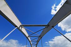 Modern Tied Arch Bridge Against Cloudy Blue Sky Stock Photography
