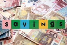 Cash Savings In Toy Letters Royalty Free Stock Photography