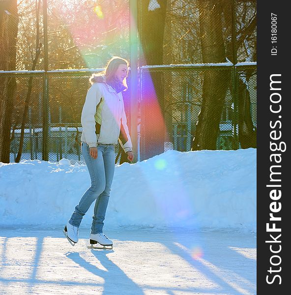 Girl on winter skate rink