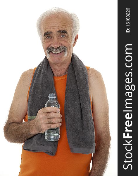 Pensioner replenishing with water after workout. Pensioner replenishing with water after workout