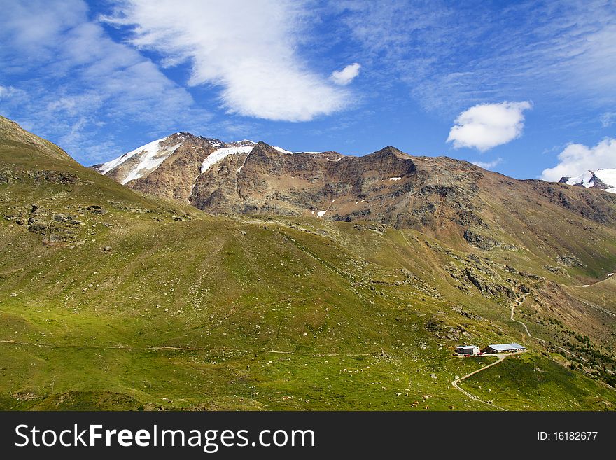 Mountains of the Valtellina with the glacier and stream
