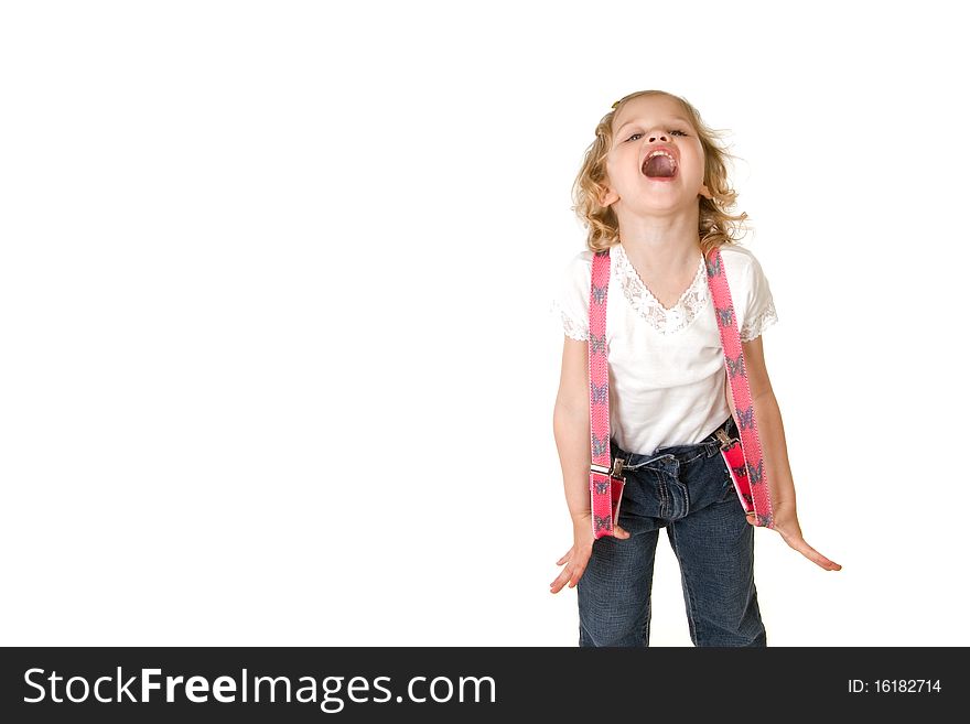 Beautiful little fashion model on white background screaming and stretching her red suspenders out to the sides