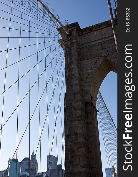 Angled view of the cables of Brooklyn Bridge with Lower Manhattan beyond