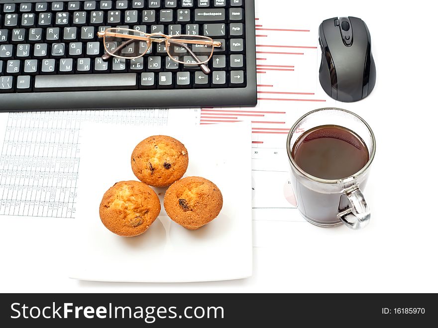 Business still-life with diagrams, glasses, coffee, cake and keyboard. Business still-life with diagrams, glasses, coffee, cake and keyboard