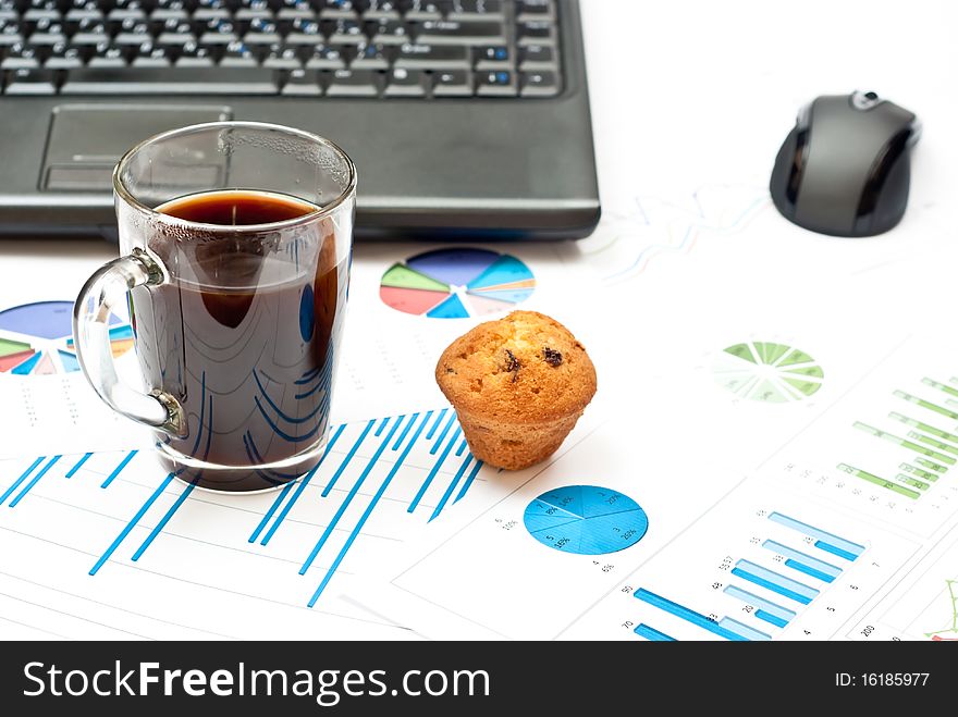 Business still-life with diagrams, coffee, cake and notebook. Business still-life with diagrams, coffee, cake and notebook