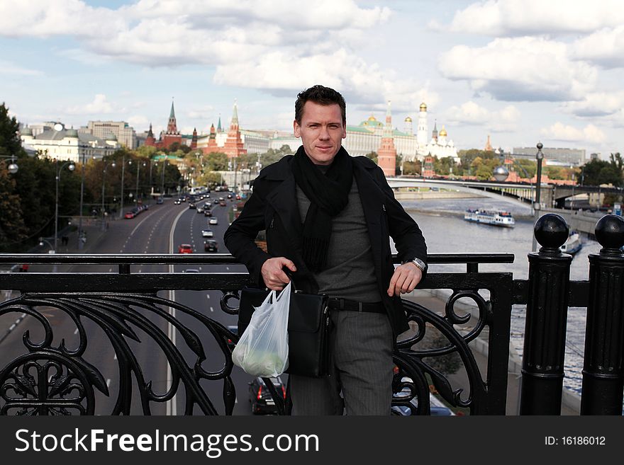Man with apples on bridge. Moscow