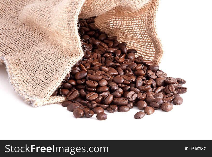 Roasted coffee beans in a canvas sack.