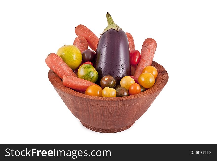 Fresh vegetables in a bowl made of wood. Fresh vegetables in a bowl made of wood.