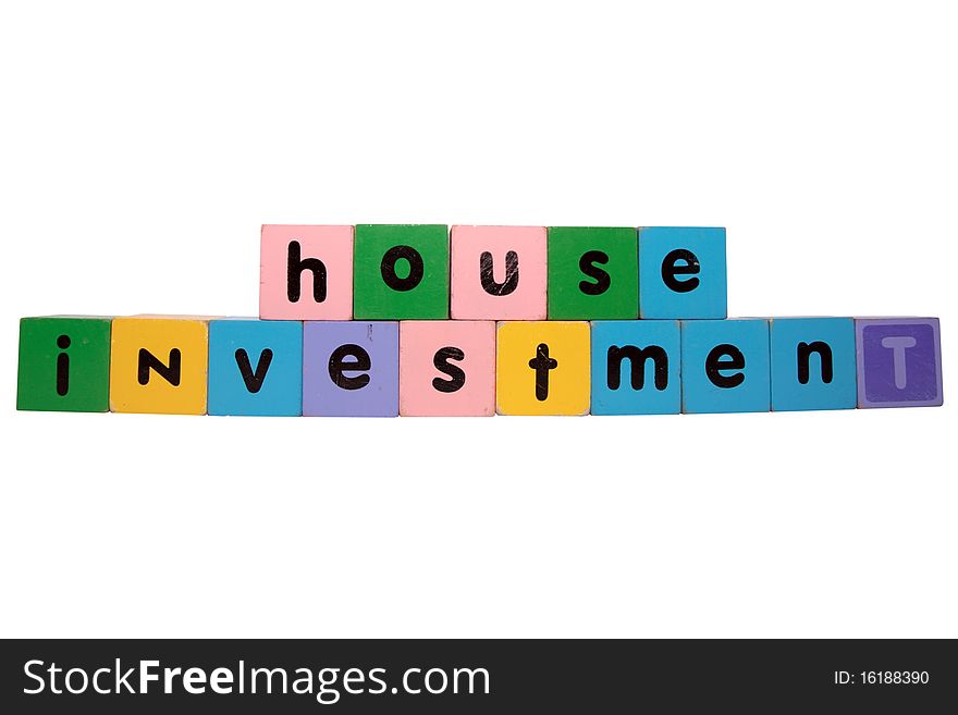 Toy letters that spell house investment against a white background with clipping path. Toy letters that spell house investment against a white background with clipping path