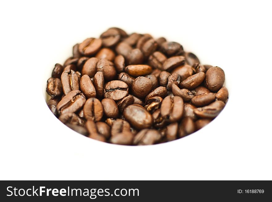 Coffee beans in the white cup