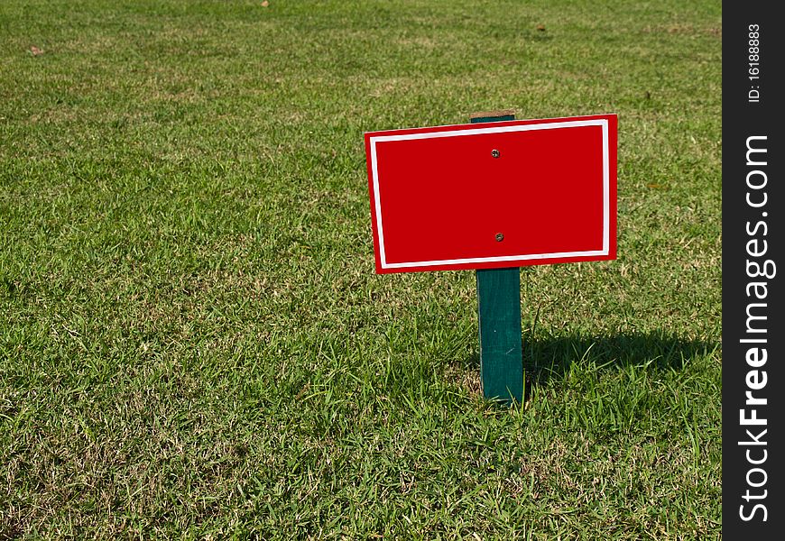 The empty red sign on field