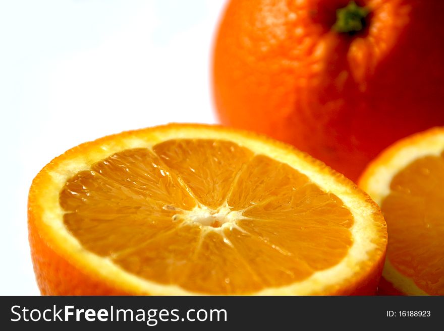 Close-up view of half of oranges and one more orange