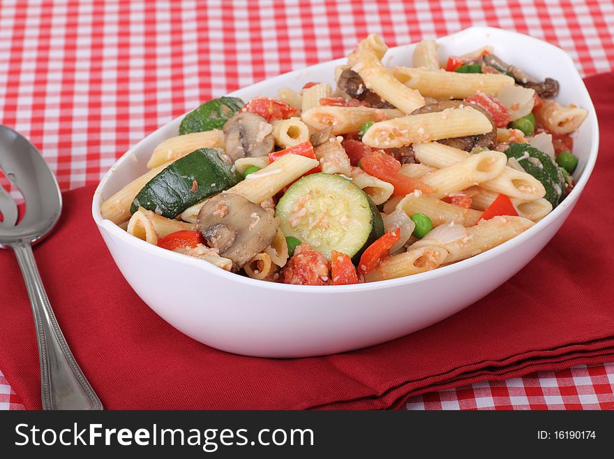 Penne pasta with mushrooms, zucchini, red peppers, peas. Penne pasta with mushrooms, zucchini, red peppers, peas