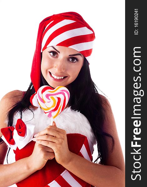 Santa girl holding a lollipop. Holidays New Year and Christmas