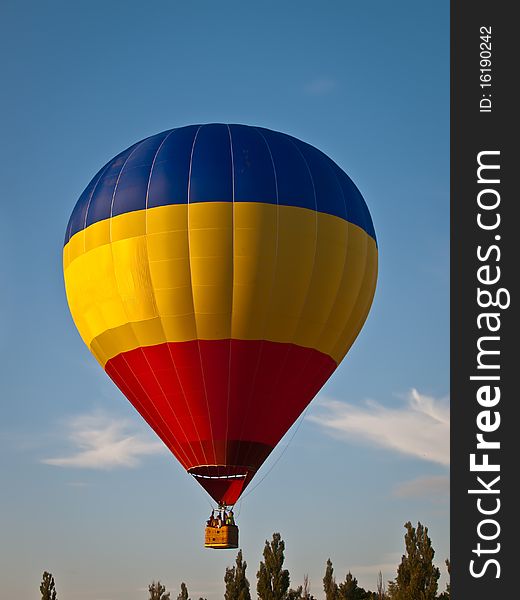 Colorful hot air balloon on blue sky. Colorful hot air balloon on blue sky