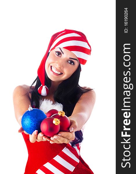 Santa girl holding a Christmas ball, Christmas toys. Holidays New Year and Christmas