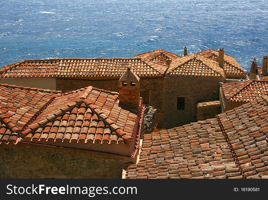 Red roofs and Mediterranean sea in Monemvasia, Greece. Red roofs and Mediterranean sea in Monemvasia, Greece