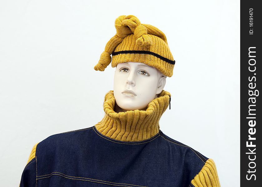 Head and torso of a male mannequin in fashion clothes - woolly hat and jumper.