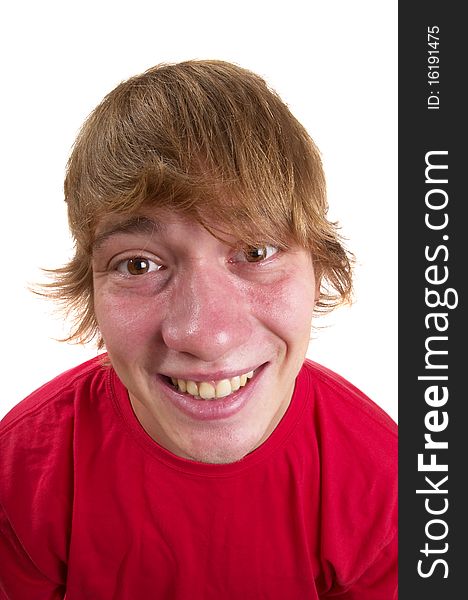 Young happy teenager portrait isolated over white background (wide angle lens shot)