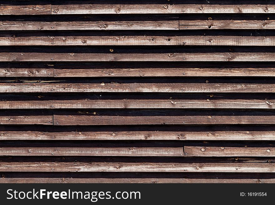 Natural colored wooden fence around industrial area. Natural colored wooden fence around industrial area