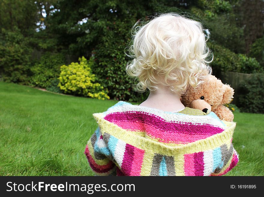 Child Cuddling Teddy Bear