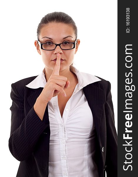 Image of business lady in suit holding her finger near the mouth. Image of business lady in suit holding her finger near the mouth