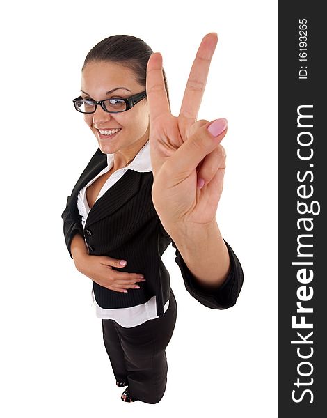 Wide angle picture of an attractive business woman making her victory sign