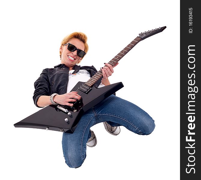 Picture of a blond passionate woman guitarist playing on her knees