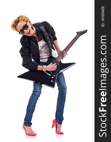 Rock star girl with sunglasses playing an electric guitar