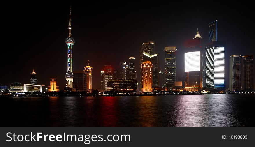 Modern Pudong district in Shanghai at night (logos removed)
