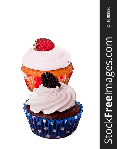 Strawberry, raspberry cupcakes over withe background. Strawberry, raspberry cupcakes over withe background