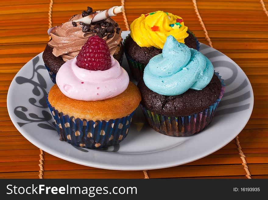 Strawberry, chocolate, blue vanilla and raspberry cupcakes. Strawberry, chocolate, blue vanilla and raspberry cupcakes