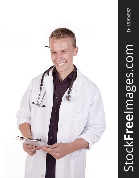 A male doctor holding his patients chart with a smile on his face. A male doctor holding his patients chart with a smile on his face.