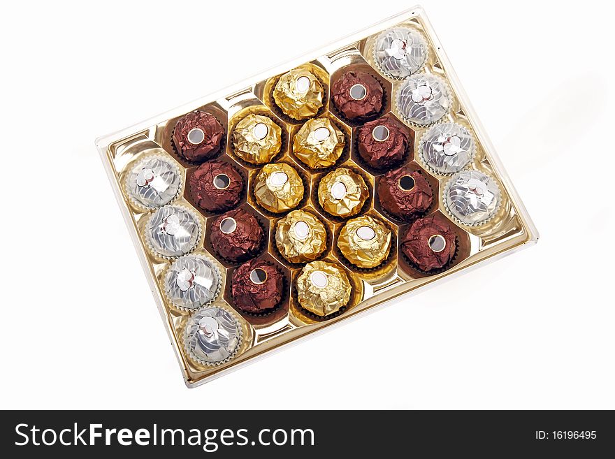 A box of chocolate sweets on white