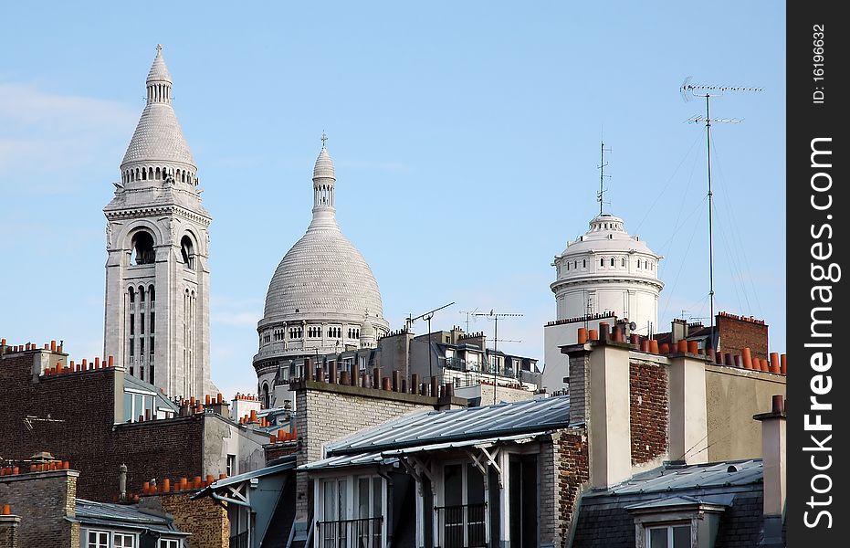 Montmartre - famous Paris district on top view with roofs, chimneys, towers and Basilica Sacre Couer, France